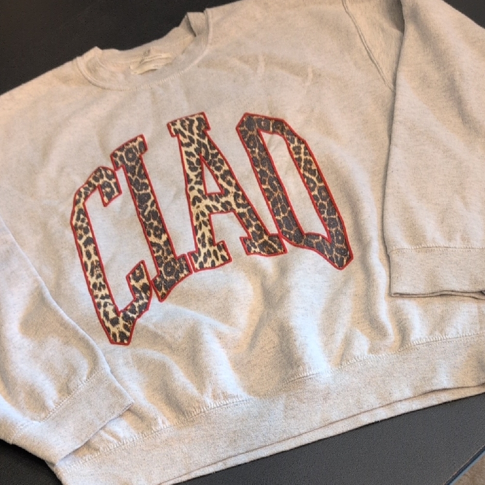 Anthropologie Light Gray Sweatshirt with Leopard 'CLAD' Applique and Red Trim